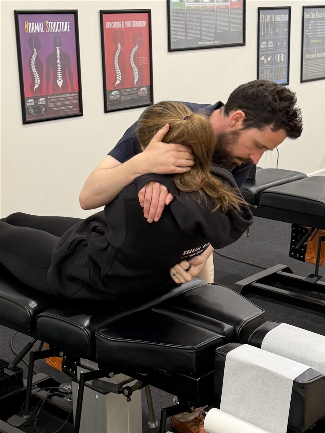 Dr Michael Harney delivering a chiropractic adjustment