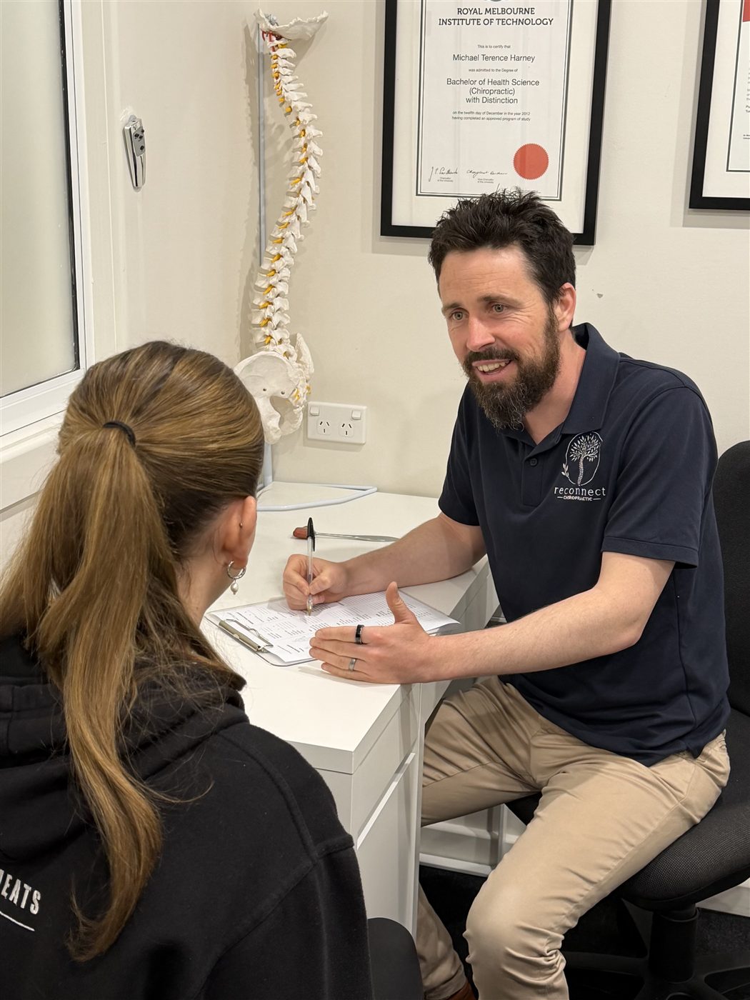 Dr Michael Harney talking with a patient during an initial consultation