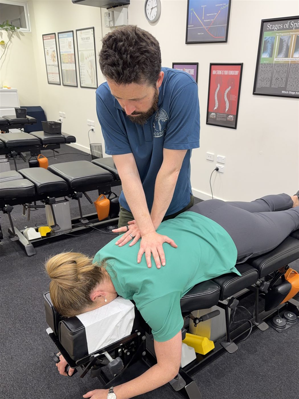 Dr Michael Harney delivering a chiropractic adjustment at Reconnect Chiropractic