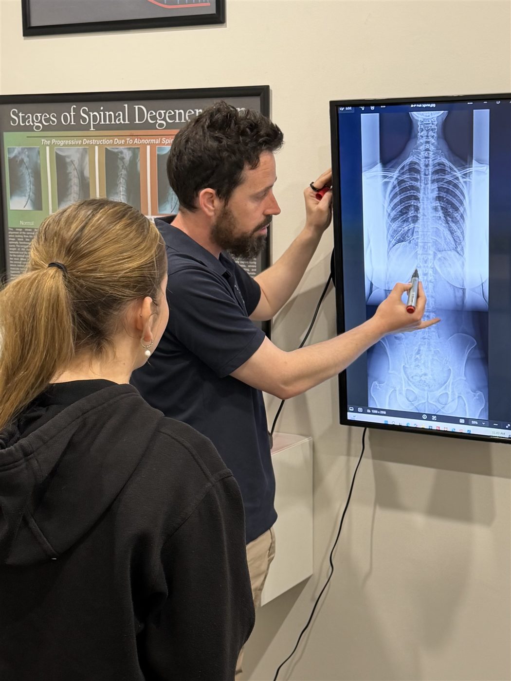 Dr Michael Harney explaining X-ray findings to a patient